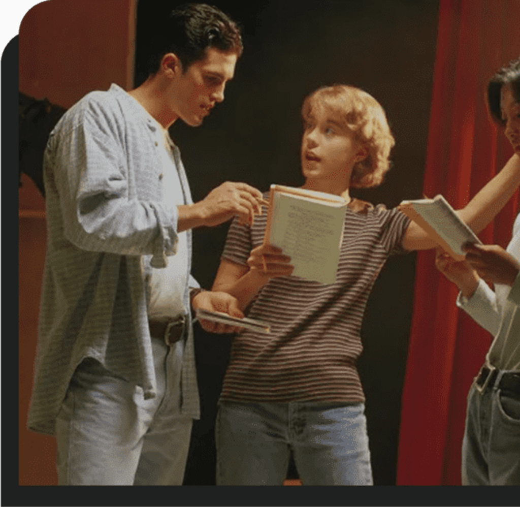 A group of people standing around each other.